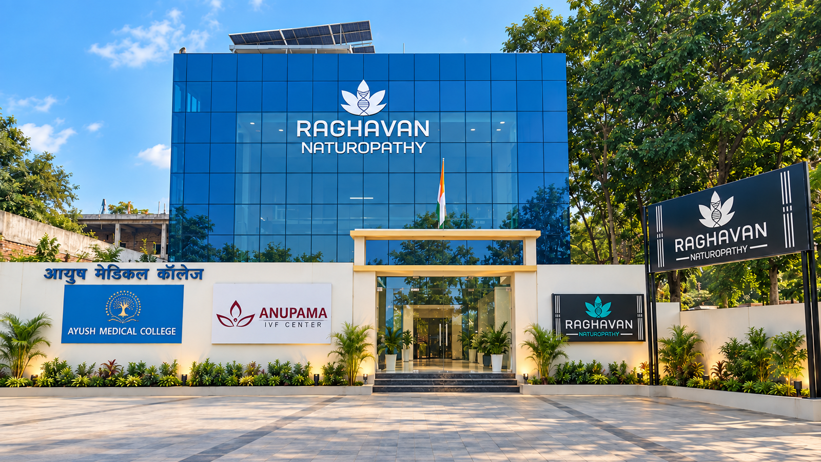 Completed Raghavan Naturopathy commercial building with its blue-glass facade and mounted signage